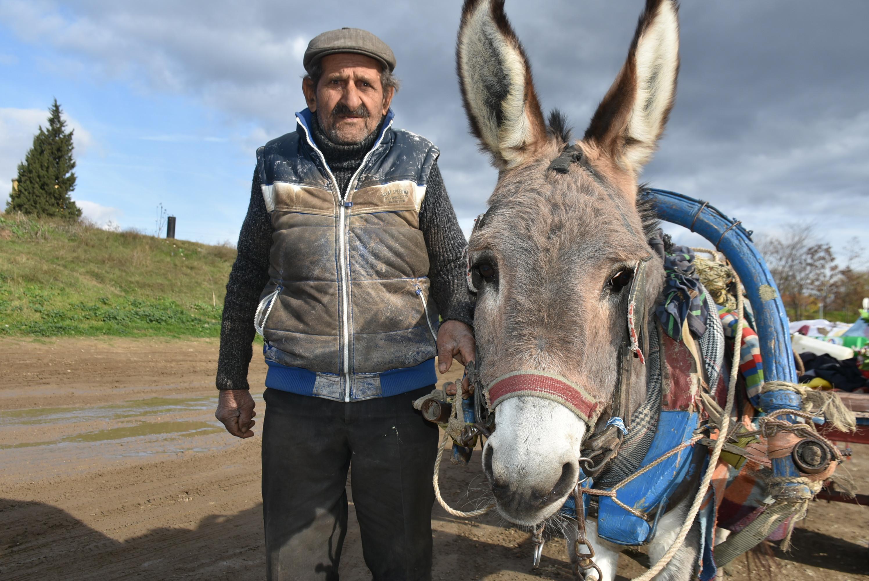 86-yeard old makes living by collecting scrap with his donkey and dog