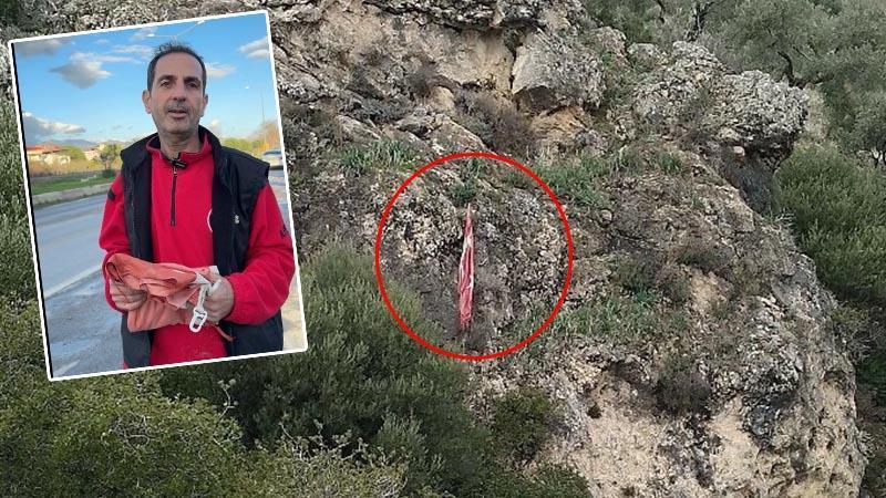 Kayalıklara takılan Türk bayrağını tereddüt etmeden kurtardı