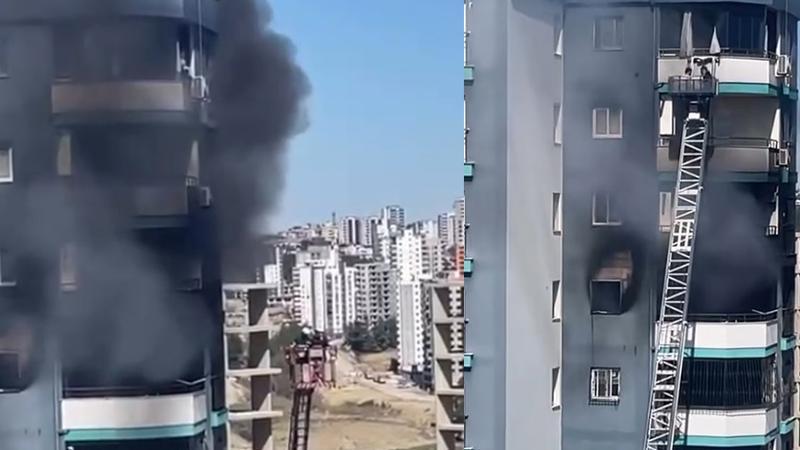 Apartmanda çıkan yangında mahsur kalan baba ve bebeğini inşaat işçisi kurtardı