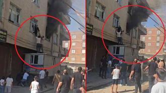 Yangında mahsur kalan kadını konteynerin üzerine çıkarak kurtardılar