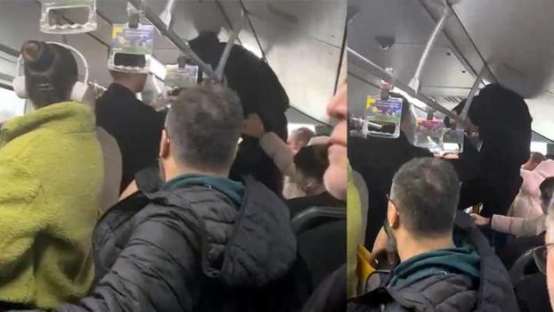 Metrobüste boş koltuk kavgasında aracın tutunma demirine tırmanıp yumruk attı