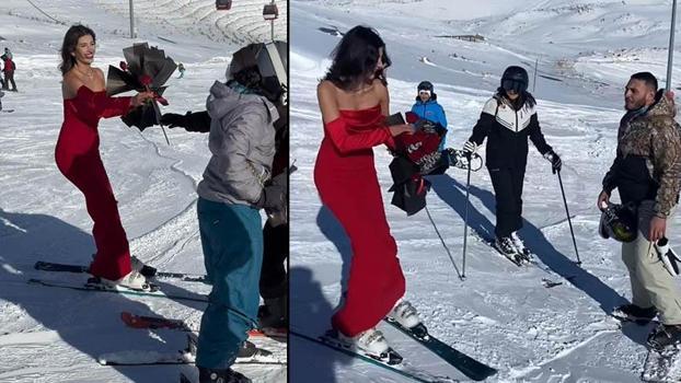 Kırmızı elbisesiyle Erciyes’te kayak yapıp, gül dağıttı