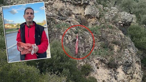 Kayalıklara takılan Türk bayrağını tereddüt etmeden kurtardı