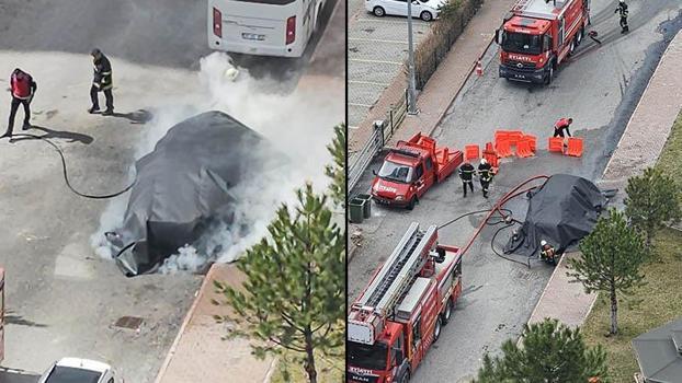 Alev alan elektrikli otomobile, yangın battaniyesi ile müdahale