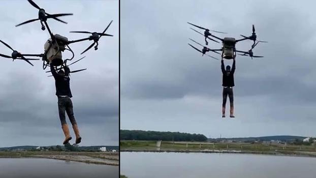 Çiftçi, drona tutunarak tarlanın diğer tarafına geçti