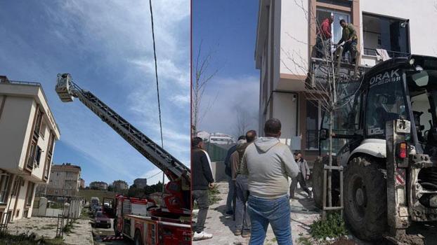 Arnavutköy’de binada çıkan yangında mahsur kalanlar kepçeyle kurtarıldı