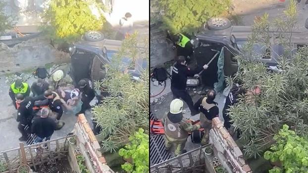 Merdivenlerden düşüp yan yatan araçta sıkışan yolcuyu itfaiye kurtardı; o anlar kamerada