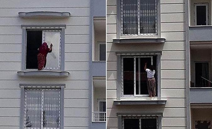 Önlem almadan cam silen kadınlar korkuttu