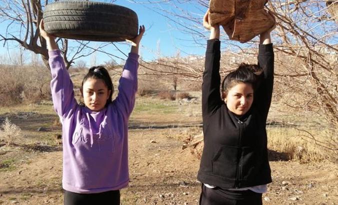 Weight-lifter sisters are preparing for the Turkish championship with tire and log
