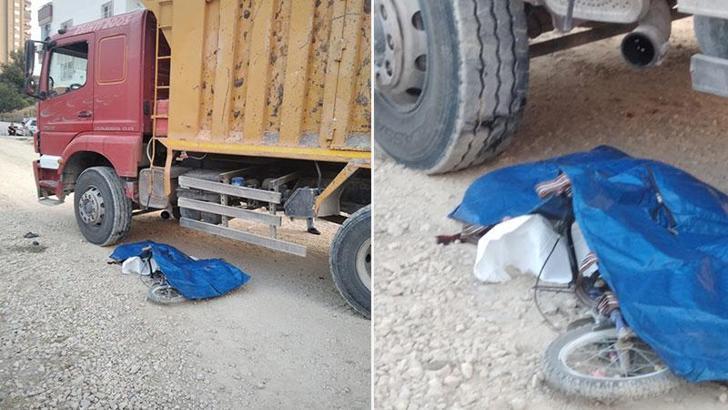 Sürücüsünün geri manevra yaptığı hafriyat kamyonunun altında kalan Alparslan, öldü