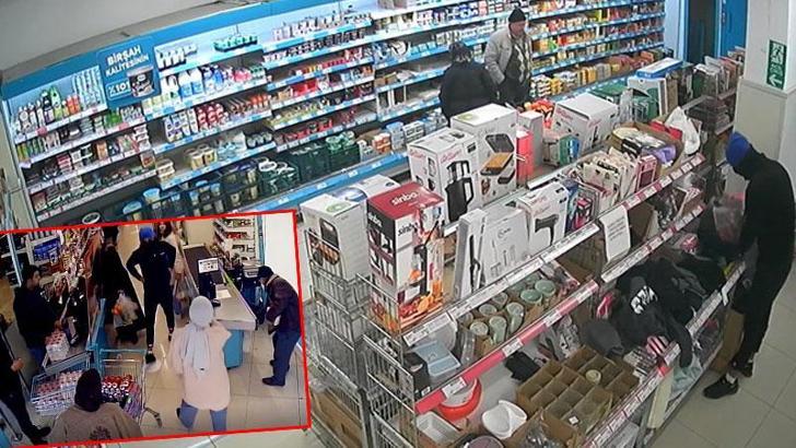 Marketten hırsızlık yaptı, fark eden kasiyere satır gösterdi