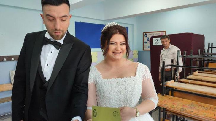Gelinlik ve damatlıkla sandıklara gittiler
