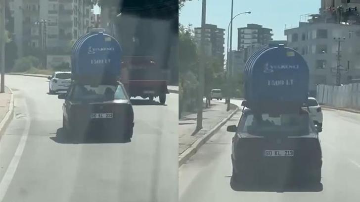 Otomobilin tavanında su tankı taşıdı
