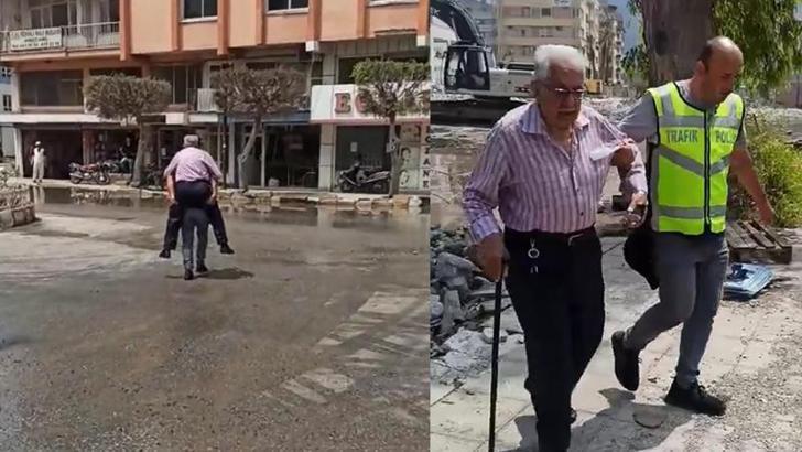 Su basan caddede depremzedeyi sırtında taşıyan polis: Görevimi yaptım
