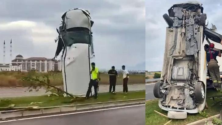 Savrulan kamyonet refüjde dik durdu