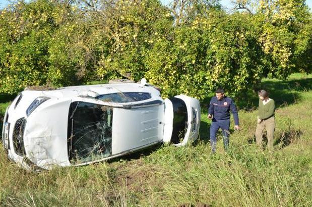 Otomobil takla atıp, portakal bahçesine savruldu
