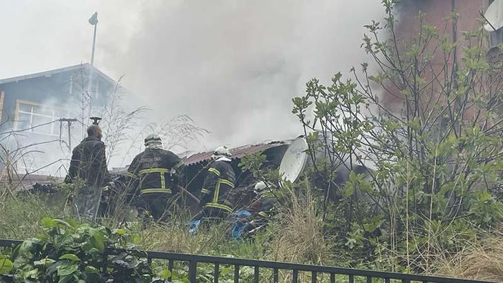 Yangında mahsur kalan görme engelliyi otopark görevlisi kurtardı