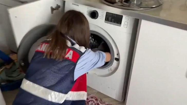 Çamaşır makinesi ile toprak altından silahlar çıktı; 16 gözaltı