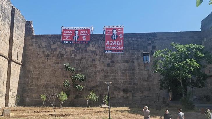 Diyarbakır'da surlara asılan 'İmamoğlu' pankartlarına polis el koydu