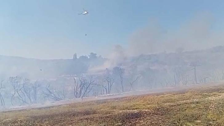 Osmaniye'de makilik alana sıçrayan anız yangını kontrol altında