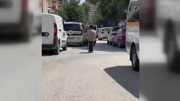 Elektrikli skuter valizle trafikte seyreden kişinin yeni görüntüleri ortaya çıktı