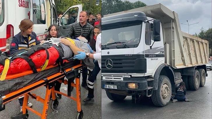 Kamyonun altında kalan motosiklet sürücüsü ağır yaralandı