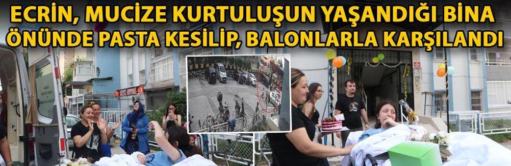 Ecrin, mucize kurtuluşun yaşandığı bina önünde pasta kesilip, balonlarla karşılandı