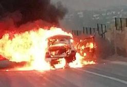 Alev topuna dönen otomobilin sürücüsü canını zor kurtardı