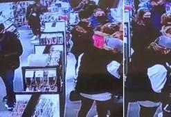 Alışveriş yapan kadınların cep telefonlarının çalınma anları kamerada