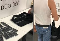 İstanbul Havalimanı'nda özel diktirdiği yeleğinden 37 cep telefonu çıktı