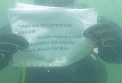 Buzu kırıp daldıkları gölde 'Kadınlar Günü' mesajı verdiler