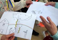 Graves, blood, and weapons in the paintings drawn by Ukrainian children