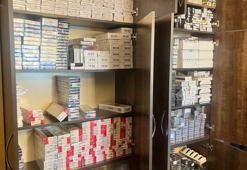 Maltepe'de kaçak içki ve sigaraların depolandığı daireye baskın