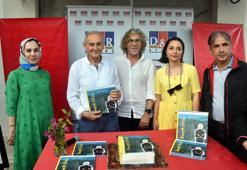 Ressam Devrim Erbil fırçasını kaleme döktüğü kitabını Bodrum'da çocuklar için imzaladı