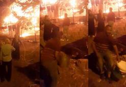 Ev yangınına, kovayla su taşıyıp, bahçe hortumuyla su sıkarak müdahale ettiler