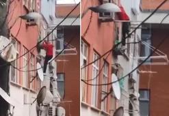 Fatih'te apartmana örümcek gibi tırmanan hırsız ev sahipleriyle karşılaşınca kaçtı