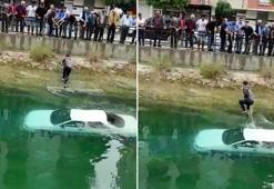 Otomobil kanala uçtu; araç üzerine çıkan sürücü halatla kurtarıldı