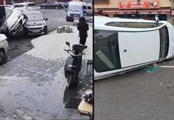 Park halindeki araçlara çarparak devrilen otomobilinde sıkıştı; kaza anı kamerada
