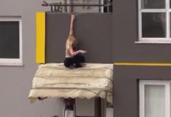 6’ncı kattaki balkonun tentesine inen kadın, itfaiye merdiveniyla alındı