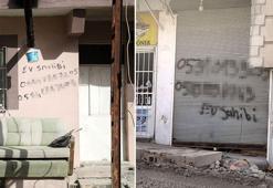 Hasarlı binaların duvarına cep telefonlarını yazıp gitmişler