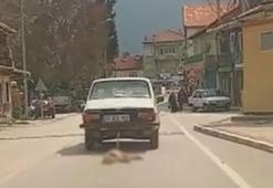 Otomobilin arkasına bağladığı köpeği sürükleyerek öldürdü; o anlar kamerada