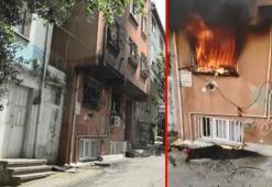 Gaziosmanpaşa'da yangında mahsur kalan kadını sürükleyerek çıkardı