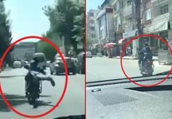 Çocuğun, motosikletin üzerine yüzüstü yatarak kullandığı anlar kamerada