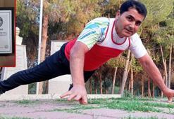 Bu kez de 'Başparmakla şınav çekme rekoru' ile Guinness'e girdi