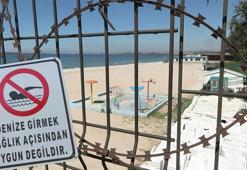 Belediye plajı kirlilikten kapalı, 200 metre mesafedeki özel plaj açık; giriş 300 lira