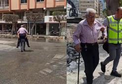 Su basan caddede depremzedeyi sırtında taşıyan polis: Görevimi yaptım