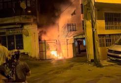 Bursa'da evin bahçesinde çıkan yangın, iş yerine sıçradı: 3 kişi dumandan etkilendi