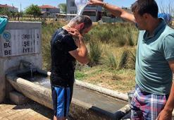 Yalakta yıkanıp, mahalledeki su sorununa tepki gösterdi