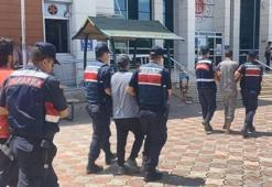 Polis yeleği ve telsizli göçmen kaçakçılığına 13 gözaltı