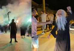 Yüzlerinde maske, ellerinde orakla damadı karşıladılar